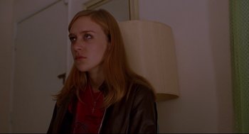 Movie still from “Boys Don't Cry” (1999), directed by Kimberly Peirce – A woman with long red hair wearing a leather jacket; Close Up shot, Over the shoulder angle
