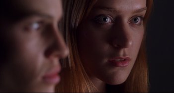 Movie still from “Boys Don't Cry” (1999), directed by Kimberly Peirce – A woman's face in a mirror; Close Up shot, Over the shoulder angle