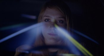 Movie still from “Boys Don't Cry” (1999), directed by Kimberly Peirce – A woman is driving a car at night; Close Up shot, Low angle