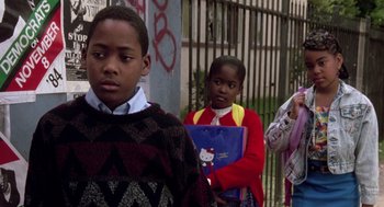 Movie still from “Boyz n the Hood” (1991), directed by John Singleton – A group of children standing next to each other on a sidewalk; Close Up shot, Low angle