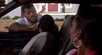 Movie still from “Boyz n the Hood” (1991), directed by John Singleton – A group of people in the back of a car; Medium shot, Over the shoulder angle