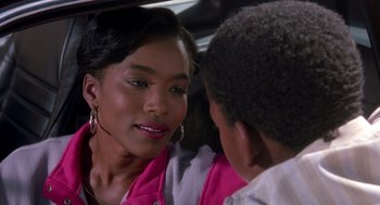 Movie still from “Boyz n the Hood” (1991), directed by John Singleton – A woman sitting next to a man in a car; Close Up shot, Over the shoulder angle