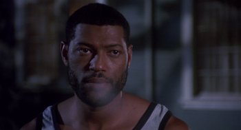 Movie still from “Boyz n the Hood” (1991), directed by John Singleton – A person wearing a tank top; Close Up shot, Low angle