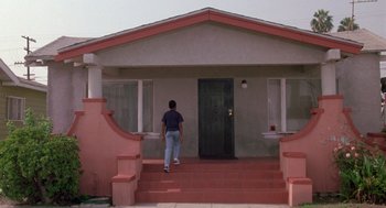 Movie still from “Boyz n the Hood” (1991), directed by John Singleton – A man walking down the steps of a house; Wide shot, Low angle