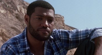 Movie still from “Boyz n the Hood” (1991), directed by John Singleton – A person wearing a plaid shirt; Close Up shot, Low angle