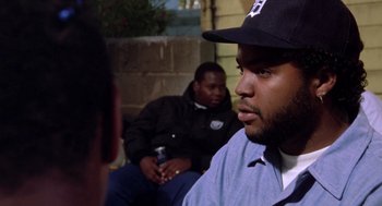 Movie still from “Boyz n the Hood” (1991), directed by John Singleton – Two men sitting on a bench talking to each other; Close Up shot, Over the shoulder angle