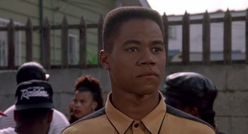 Movie still from “Boyz n the Hood” (1991), directed by John Singleton – A young man with blue eyes is looking to his left; Close Up shot, Low angle