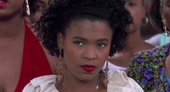 Movie still from “Boyz n the Hood” (1991), directed by John Singleton – A person wearing a white shirt; Close Up shot, Over the shoulder angle