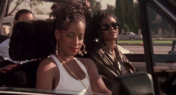 Movie still from “Boyz n the Hood” (1991), directed by John Singleton – Two women sitting in the back seat of a car; Close Up shot, Over the shoulder angle