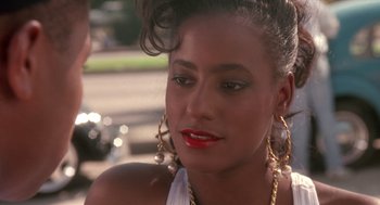 Movie still from “Boyz n the Hood” (1991), directed by John Singleton – A person wearing a white shirt; Close Up shot, Over the shoulder angle