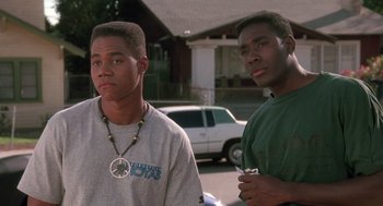Movie still from “Boyz n the Hood” (1991), directed by John Singleton – Two young men standing next to each other on the street; Close Up shot, Low angle