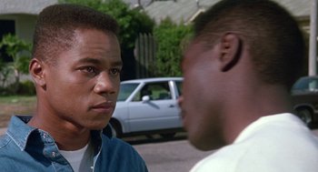 Movie still from “Boyz n the Hood” (1991), directed by John Singleton – Two men standing next to each other on the street; Close Up shot, Over the shoulder angle