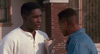 Movie still from “Boyz n the Hood” (1991), directed by John Singleton – Two young men standing next to each other on a sidewalk; Close Up shot, Over the shoulder angle