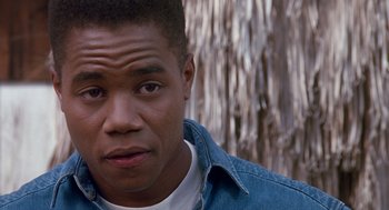 Movie still from “Boyz n the Hood” (1991), directed by John Singleton – A person wearing a jean jacket; Close Up shot, High angle