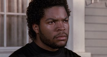 Movie still from “Boyz n the Hood” (1991), directed by John Singleton – A person wearing a black shirt; Close Up shot, Low angle