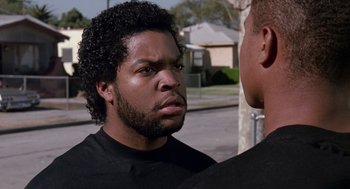Movie still from “Boyz n the Hood” (1991), directed by John Singleton – Two men standing next to each other on a street; Close Up shot, Over the shoulder angle