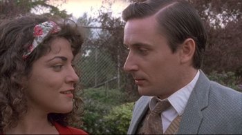 Movie still from “Dead Alive” (1992), directed by Peter Jackson – A man and a woman standing next to each other; Close Up shot, Low angle