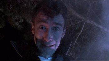 Movie still from “Dead Alive” (1992), directed by Peter Jackson – A person with his eyes wide open; Close Up shot, Low angle