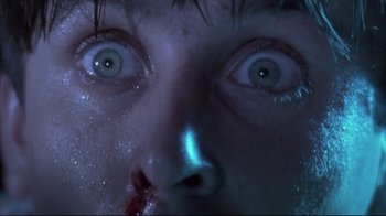Movie still from “Dead Alive” (1992), directed by Peter Jackson – A person's eyes with blood on them; Extreme Close Up shot, Overhead angle