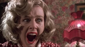 Movie still from “Dead Alive” (1992), directed by Peter Jackson – A person with a mouth wide open; Close Up shot, Low angle