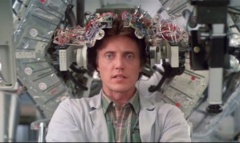 Movie still from “Brainstorm” (1983), directed by Douglas Trumbull – A man wearing a white lab coat with wires on his head; Close Up shot, Low angle
