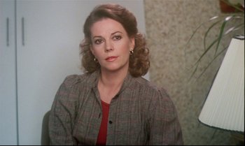 Movie still from “Brainstorm” (1983), directed by Douglas Trumbull – A person with curly hair wearing a plaid shirt; Close Up shot, Over the shoulder angle