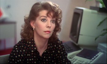 Movie still from “Brainstorm” (1983), directed by Douglas Trumbull – A person sitting in front of a computer; Close Up shot, Over the shoulder angle