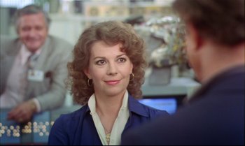 Movie still from “Brainstorm” (1983), directed by Douglas Trumbull – A person with curly hair; Close Up shot, Over the shoulder angle