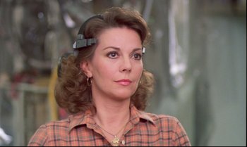 Movie still from “Brainstorm” (1983), directed by Douglas Trumbull – A person wearing a plaid shirt; Close Up shot, Over the shoulder angle