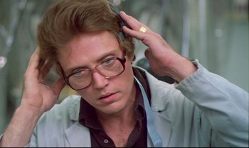 Movie still from “Brainstorm” (1983), directed by Douglas Trumbull – A person wearing glasses; Close Up shot, Low angle