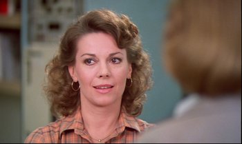 Movie still from “Brainstorm” (1983), directed by Douglas Trumbull – A person wearing a plaid shirt; Close Up shot, Over the shoulder angle