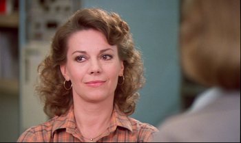 Movie still from “Brainstorm” (1983), directed by Douglas Trumbull – A person wearing a plaid shirt; Close Up shot, Over the shoulder angle