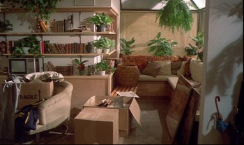 Movie still from “Brainstorm” (1983), directed by Douglas Trumbull – A living room filled with furniture next to a bookshelf; Wide shot, High angle