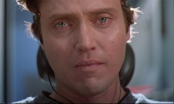 Movie still from “Brainstorm” (1983), directed by Douglas Trumbull – A person wearing headphones; Close Up shot, Low angle