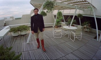 Movie still from “Brainstorm” (1983), directed by Douglas Trumbull – A man standing on top of a wooden deck; Wide shot, Low angle