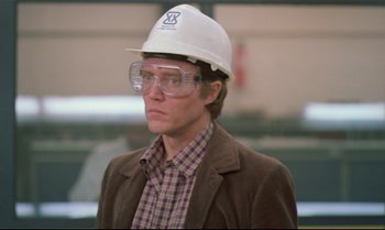 Movie still from “Brainstorm” (1983), directed by Douglas Trumbull – A man wearing a hard hat and safety glasses; Close Up shot, Low angle