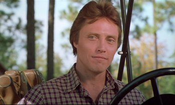 Movie still from “Brainstorm” (1983), directed by Douglas Trumbull – A person sitting in a car; Close Up shot, Low angle