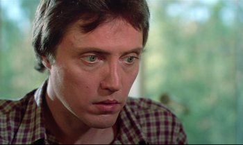 Movie still from “Brainstorm” (1983), directed by Douglas Trumbull – A man's face with green eyes; Close Up shot, Low angle