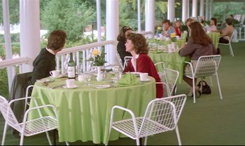 Movie still from “Brainstorm” (1983), directed by Douglas Trumbull – A group of people sitting at a table with green tablecloths; Wide shot, High angle