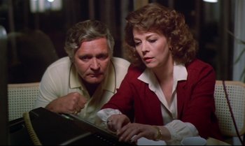 Movie still from “Brainstorm” (1983), directed by Douglas Trumbull – A man and a woman looking at a computer screen; Medium shot, High angle