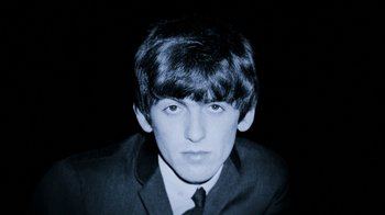 Movie still from “The Beatles: Eight Days a Week - The Touring Years” (2016), directed by Ron Howard – A young man in a suit and tie; Close Up shot, High angle