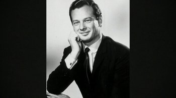Movie still from “The Beatles: Eight Days a Week - The Touring Years” (2016), directed by Ron Howard – Black and white photograph of a man in a suit and tie; Close Up shot, High angle