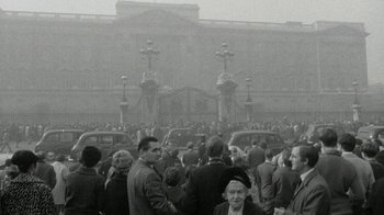 Movie still from “The Beatles: Eight Days a Week - The Touring Years” (2016), directed by Ron Howard – A crowd of people standing around a building; Extreme Wide shot, High angle
