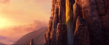 Movie still from “Brave” (2012), directed by Steve Purcell – A man standing on top of a tall mountain; Extreme Wide shot, Low angle