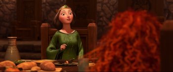 Movie still from “Brave” (2012), directed by Steve Purcell – A woman sitting at a table with a plate of food in front of her; Medium shot, Over the shoulder angle