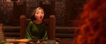 Movie still from “Brave” (2012), directed by Steve Purcell – A woman sitting at a table with a candle in front of her face; Medium shot, Over the shoulder angle