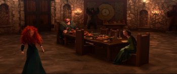 Movie still from “Brave” (2012), directed by Steve Purcell – A group of people sitting around a table with food on top of it; Wide shot, High angle
