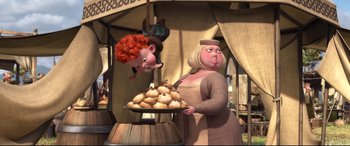 Movie still from “Brave” (2012), directed by Steve Purcell – An animated woman holding a plate of food next to a stuffed animal; Wide shot, Low angle