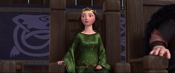 Movie still from “Brave” (2012), directed by Steve Purcell – A woman in a green dress sitting in a chair; Medium shot, High angle