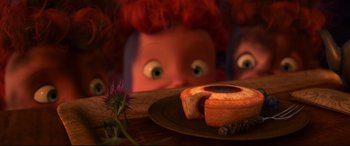 Movie still from “Brave” (2012), directed by Steve Purcell – An image of an animated character looking at a piece of food; Extreme Close Up shot, Overhead angle